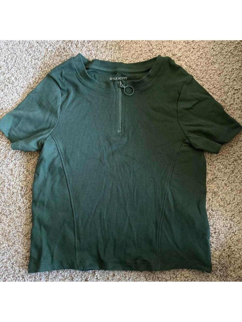 Green ribbed quarter zip crop top . Says size M but fits like a S.
